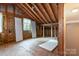 An unfinished attic space with exposed wood beams, offering potential for customization and expansion at 1108 Old Dallas Hwy, Dallas, NC 28034