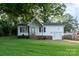Charming single-story home featuring white siding, a brick foundation, and a well-maintained lawn at 1108 Old Dallas Hwy, Dallas, NC 28034