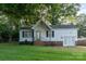 Charming single-story home featuring white siding, a brick foundation, and a well-maintained lawn at 1108 Old Dallas Hwy, Dallas, NC 28034