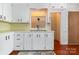Bright and airy kitchen featuring white cabinets, and ample counter space and updated sink at 1108 Old Dallas Hwy, Dallas, NC 28034