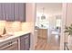 Elegant butler's pantry with stylish cabinetry, marble backsplash, and a wine refrigerator at 116 S Broad St, Waxhaw, NC 28173