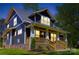 Charming craftsman-style home with a welcoming front porch and meticulous landscaping at 116 S Broad St, Waxhaw, NC 28173