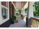 Charming front porch with brick pillars, wooden railings, and a welcoming 'Welcome' mat at 116 S Broad St, Waxhaw, NC 28173