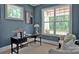 Well-lit home office with a modern desk, comfortable seating, and stylish decor at 116 S Broad St, Waxhaw, NC 28173