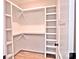 Spacious walk-in closet featuring custom shelving and rod system for optimal organization at 116 S Broad St, Waxhaw, NC 28173