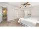 Bright bedroom features white walls, carpeted floor, and a ceiling fan with integrated lighting at 1209 Alfred St, Charlotte, NC 28211