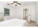 A bright bedroom featuring carpet flooring, ceiling fan and windows for natural light at 1209 Alfred St, Charlotte, NC 28211