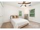 Well-lit bedroom with ceiling fan and neutral decor offers a calm and inviting space at 1209 Alfred St, Charlotte, NC 28211