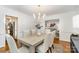 Bright dining room features hardwood floors, contemporary lighting, and stylish furniture at 1209 Alfred St, Charlotte, NC 28211