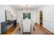 Elegant dining room with hardwood floors, contemporary lighting, and stylish furniture at 1209 Alfred St, Charlotte, NC 28211