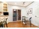 Bright eat-in kitchen with white cabinets, a breakfast nook, and sliding glass door to a patio at 1209 Alfred St, Charlotte, NC 28211