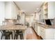 Bright kitchen features granite countertops, stainless steel appliances, white cabinets, and a breakfast bar at 1209 Alfred St, Charlotte, NC 28211