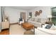 Cozy living room with stylish decor, hardwood floors, and lots of natural light at 1209 Alfred St, Charlotte, NC 28211