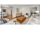 Open-concept living area with hardwood floors and a view into the dining room at 1209 Alfred St, Charlotte, NC 28211