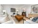 Bright living room featuring hardwood floors, neutral furniture, and an open layout at 1209 Alfred St, Charlotte, NC 28211