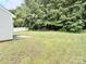 Expansive backyard with lush greenery, partial fence, and shade trees at 1252 Shenandoah Cir, Rock Hill, SC 29730
