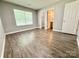 Bright bedroom with a window, neutral walls, and an en-suite bathroom at 1252 Shenandoah Cir, Rock Hill, SC 29730