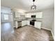 Bright kitchen features white cabinets, modern appliances, and stylish flooring at 1252 Shenandoah Cir, Rock Hill, SC 29730