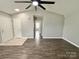 Neutral living area with modern fan, wood-look flooring and hallway entrance at 1252 Shenandoah Cir, Rock Hill, SC 29730