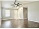 Spacious living room with modern fan, neutral paint, and tile and wood-look flooring at 1252 Shenandoah Cir, Rock Hill, SC 29730