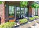 Outdoor balcony area with comfortable seating and charming curb appeal at 130 Rail Crossing Ln # 101, Charlotte, NC 28209