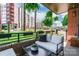 Inviting balcony with comfortable seating and hanging plants, perfect for relaxation at 130 Rail Crossing Ln # 101, Charlotte, NC 28209