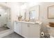Modern bathroom with double vanity, sleek mirrors, and a glass-enclosed shower at 130 Rail Crossing Ln # 101, Charlotte, NC 28209