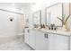 Stylish bathroom boasts double sinks, modern fixtures, and a shower-tub combination at 130 Rail Crossing Ln # 101, Charlotte, NC 28209