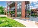 Modern brick building featuring well-maintained balconies and manicured landscaping at 130 Rail Crossing Ln # 101, Charlotte, NC 28209