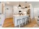 Bright kitchen featuring quartz island, stainless appliances, and modern lighting at 130 Rail Crossing Ln # 101, Charlotte, NC 28209