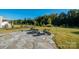 Backyard featuring a stone patio with a fire pit and seating at 14210 Asbury Park Rd, Huntersville, NC 28078