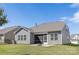 Backyard with stone patio, fire pit, and screened-in porch at 14210 Asbury Park Rd, Huntersville, NC 28078