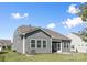 Well-maintained backyard with a screened porch at 14210 Asbury Park Rd, Huntersville, NC 28078
