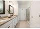 Stylish bathroom features double vanity, granite countertops, and glass-enclosed shower at 14210 Asbury Park Rd, Huntersville, NC 28078