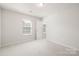 Bright bedroom with a window and access to a walk-in closet at 14210 Asbury Park Rd, Huntersville, NC 28078