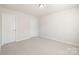 Neutral bedroom with two doors at 14210 Asbury Park Rd, Huntersville, NC 28078