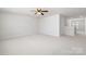 Large bonus room with ceiling fan, perfect for recreation at 14210 Asbury Park Rd, Huntersville, NC 28078