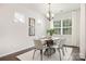 Dining area featuring natural light, an oval table, and seating for six at 14210 Asbury Park Rd, Huntersville, NC 28078