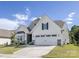 Beautiful home with a two-car garage, stone accents, and well-maintained landscaping, perfect for suburban living at 14210 Asbury Park Rd, Huntersville, NC 28078
