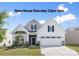 Charming two-story home featuring a manicured lawn, a two-car garage, and decorative shutters, ideal for Gathering living at 14210 Asbury Park Rd, Huntersville, NC 28078