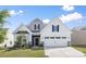 Beautiful home featuring a two-car garage and manicured landscaping at 14210 Asbury Park Rd, Huntersville, NC 28078