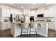 Bright kitchen with stainless steel appliances, granite countertops, and white cabinets at 14210 Asbury Park Rd, Huntersville, NC 28078