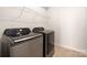 Modern laundry room featuring updated front load washer and dryer at 14210 Asbury Park Rd, Huntersville, NC 28078