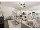 Open concept living room connects with a staircase, kitchen, with hardwood floors at 14210 Asbury Park Rd, Huntersville, NC 28078