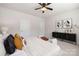 Main bedroom with decorative dresser, plenty of light, and soft carpet at 14210 Asbury Park Rd, Huntersville, NC 28078