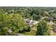 Aerial view of a lovely residential property with mature trees in a beautiful neighborhood at 150 Pleasant Grove Ln, Mooresville, NC 28115