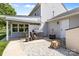 Outdoor patio area with a grill, gravel groundcover, and storage shed at 150 Pleasant Grove Ln, Mooresville, NC 28115