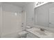 Bathroom with white vanity, mirror, and shower/tub combination at 150 Pleasant Grove Ln, Mooresville, NC 28115
