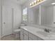 Well-lit bathroom with vanity, a large mirror, and updated fixtures at 150 Pleasant Grove Ln, Mooresville, NC 28115