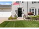 Inviting front door with manicured landscaping, and a home security system for added peace of mind at 150 Pleasant Grove Ln, Mooresville, NC 28115